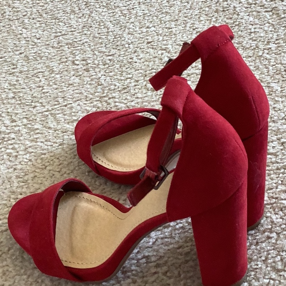 Red heels, worn one, price is firm.